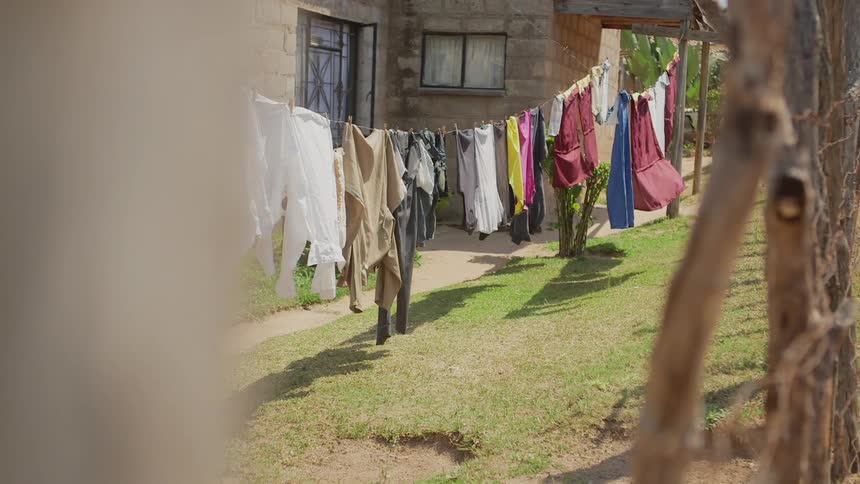 Laundry hangs to dry outside on a clothesline