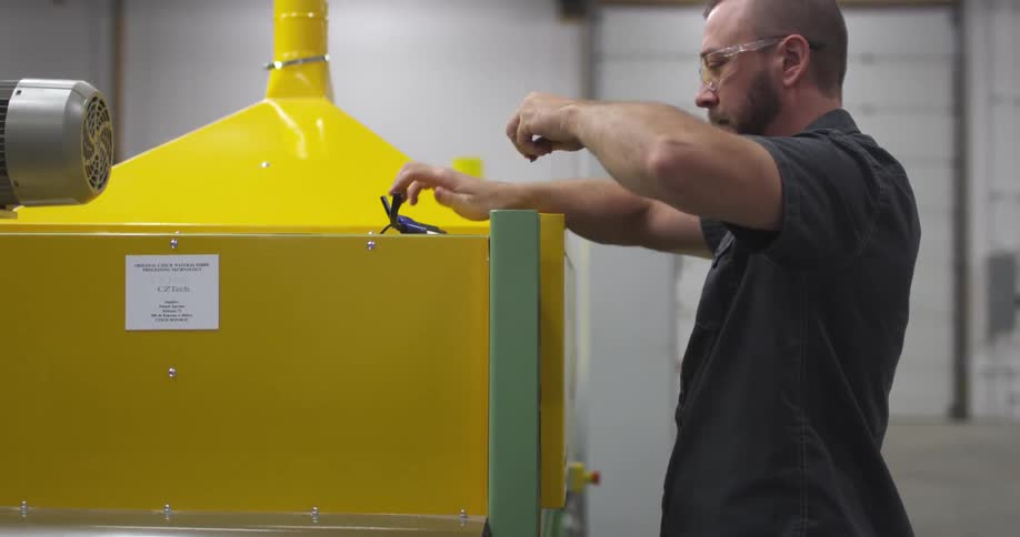 Man working on a large piece of machinery