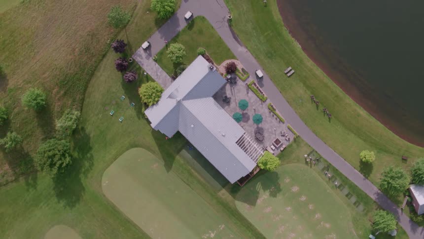 A large house is filmed from a drone