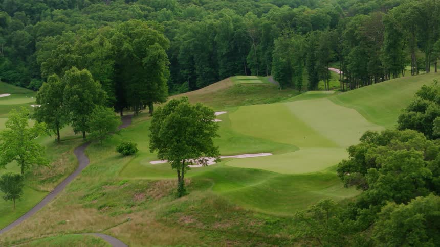 The golf course is lush with very green grass