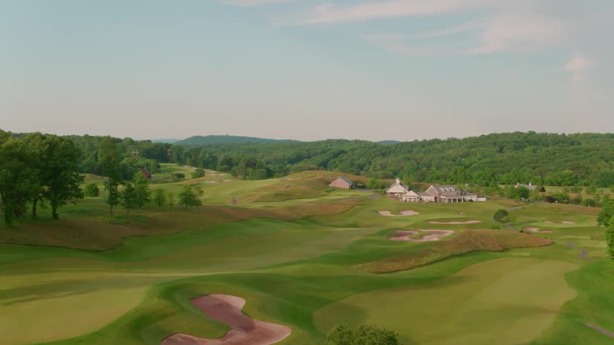A golf course is shown on a clear day