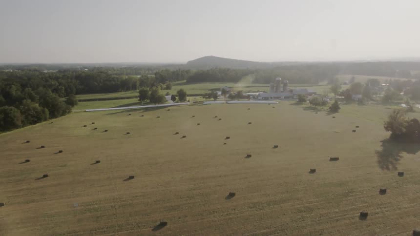 The sun shines on a rural farm