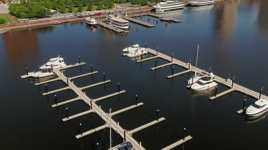 The docks are almost empty with only a few boats parked