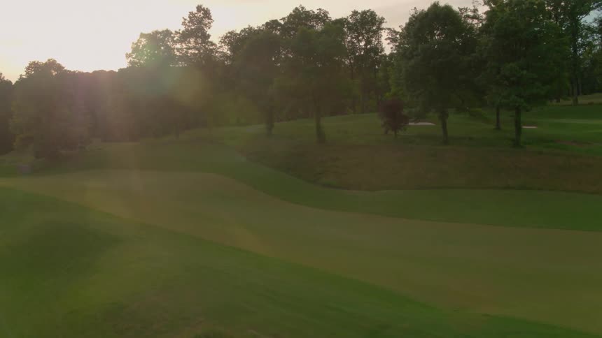 A green golf course at dawn