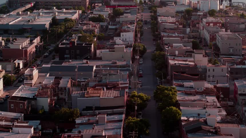 Buildings cover the ground at sunset