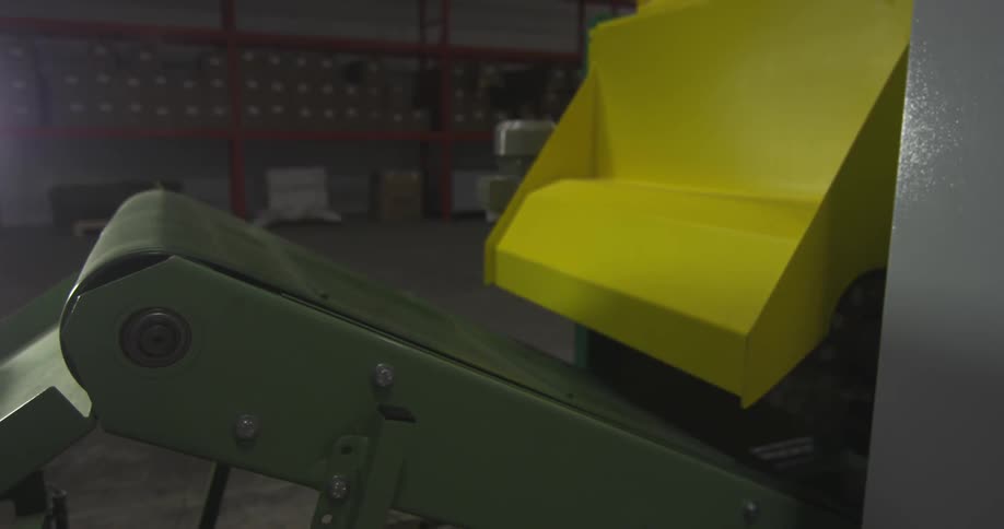 Manufacturing machinery running in a large warehouse
