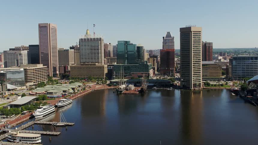A harbor that's next to a big city is filmed from above