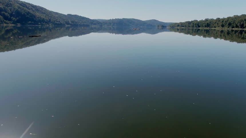 A calm lake is being flown over