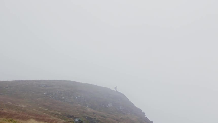 A person standing on a mountain