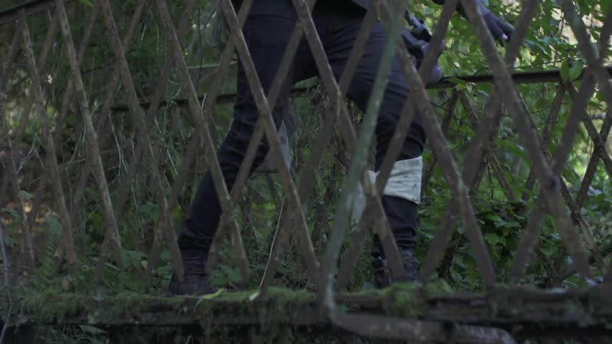 A person walking over a bridge