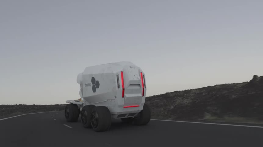 A large white truck is speeding down the road