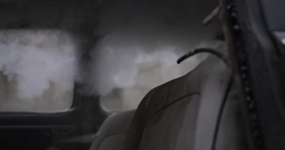 A car has smoke lingering inside of it