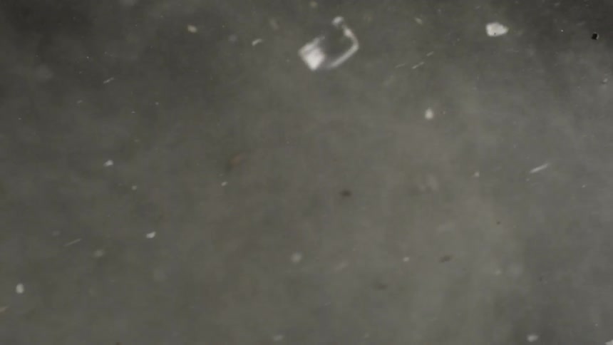 Debris and smoke from an explosion shoots through the air