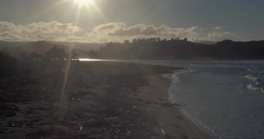 The sun shines down on a beach