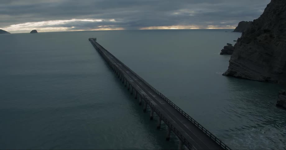 A long pier goes out into the water