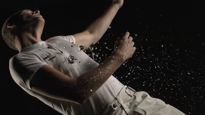 Man flies through the air with debris