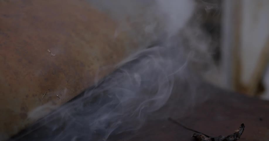 Smoke is rising from the metal slowly