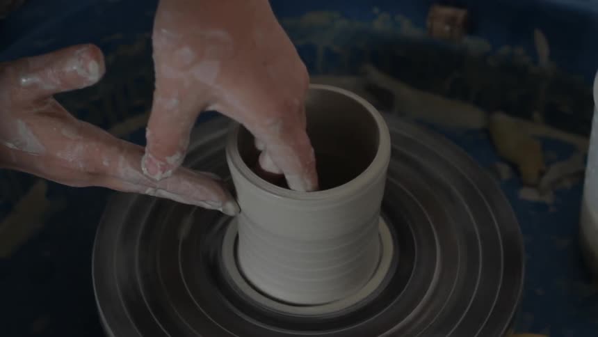 A person making pottery