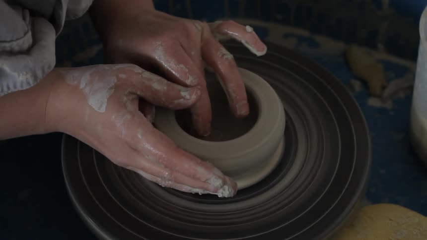 A person making pottery
