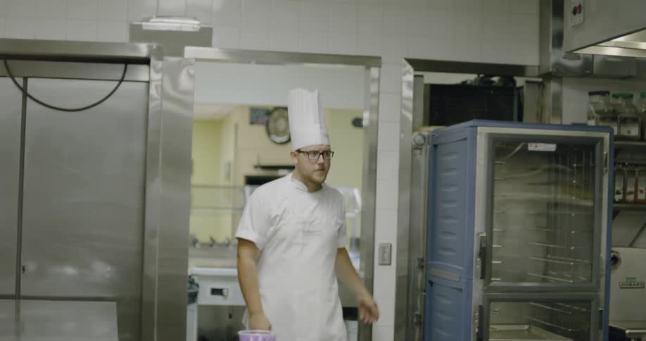 Chef enters kitchen and turns on lights