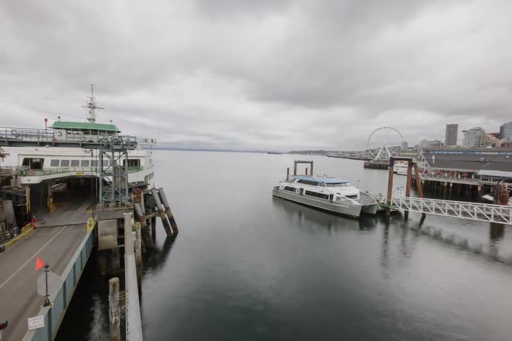 A ferry loading and unloading at a dock