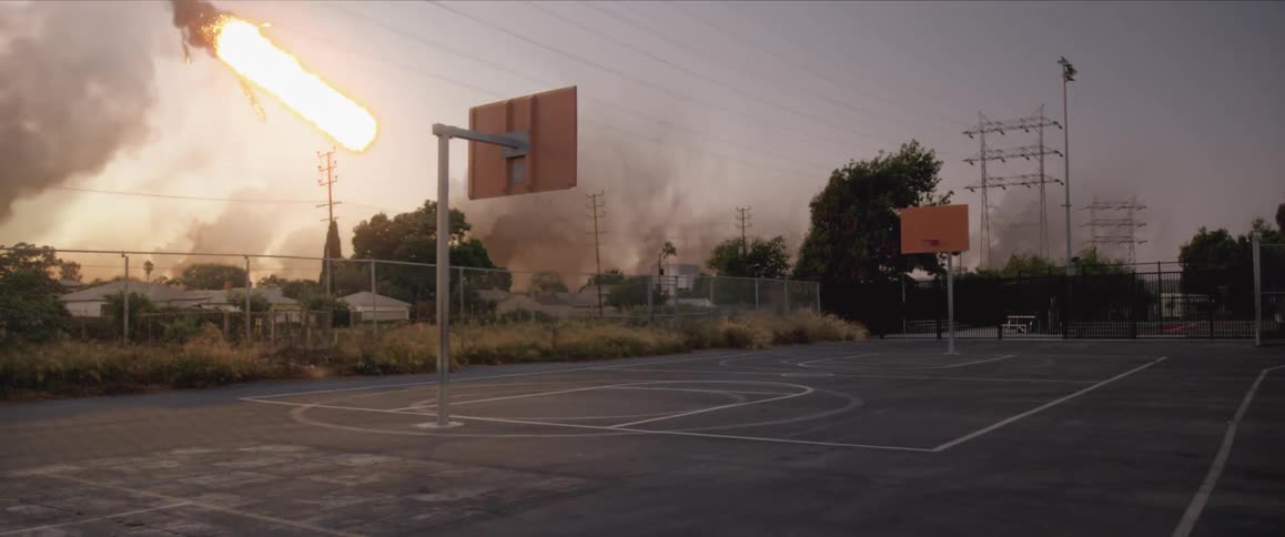 A meteor is crashing into a basketball court
