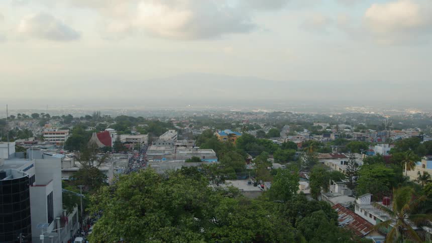 The town has many homes and trees all around