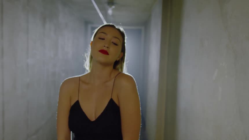 Woman walks through a hallway