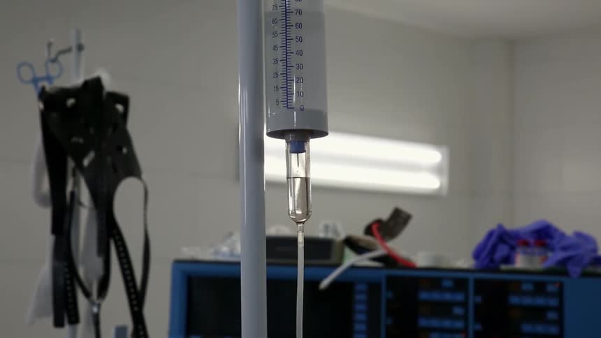 Saline drips from an iv in a medical setting