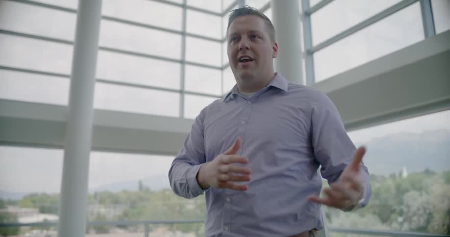 An instructor is speaking in an office building during the day