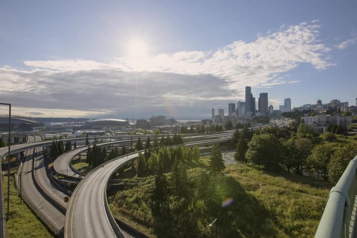 Cars drive on a city highway
