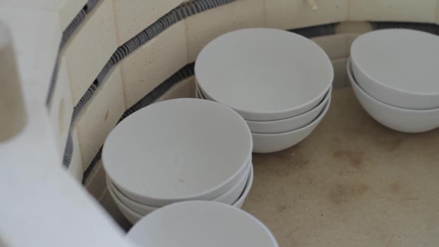 Several bowls line a barrel
