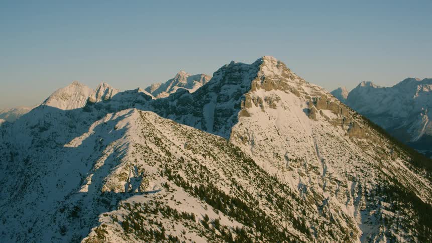 Snow covers a mountain ridge