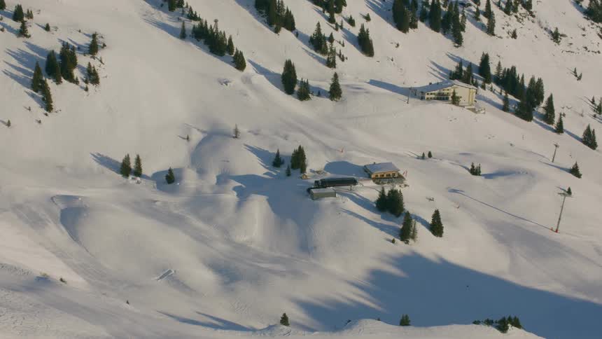 A snow covered ski resort on a mountain