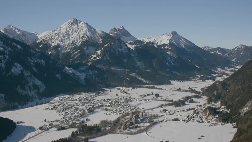 Snow covers a mountain valley