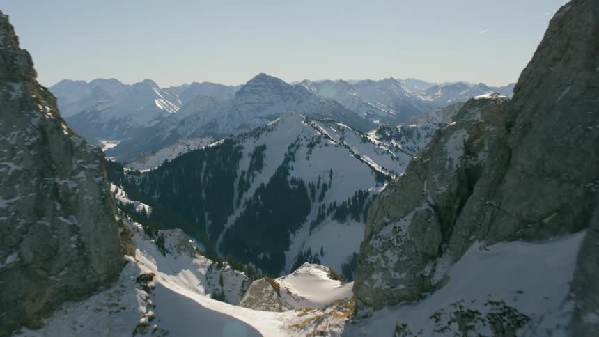 Snow covers rocky mountain peaks