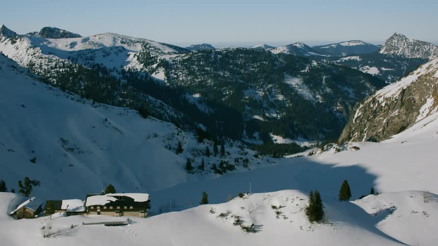 A ski lodge on top of a snow covered mountain