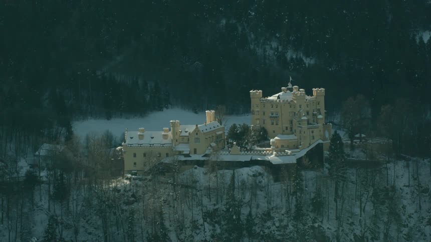 Large buildings sit on the mountain top