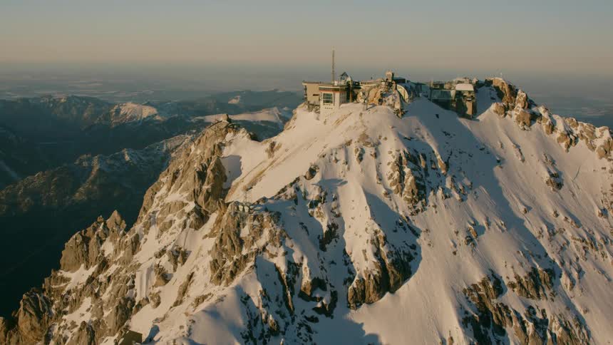 The Zugspitzbahn sits on top of a snowy mountain