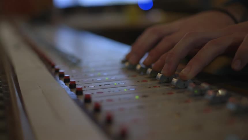 A person is mixing music