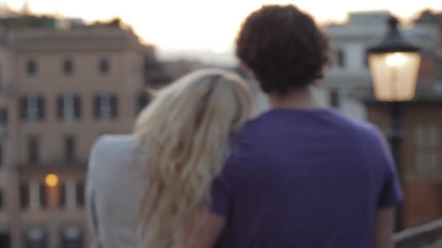 A couple is watching the city