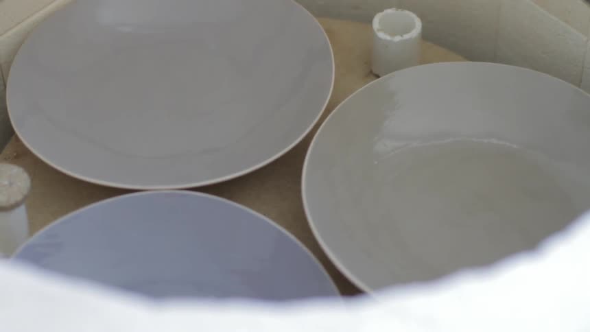 Dishes sitting in a round container