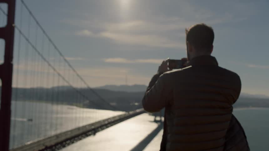 Man photographs the golden gate bridge