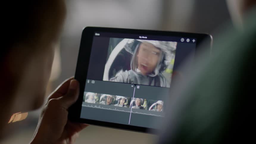 Woman watches a video on a tablet