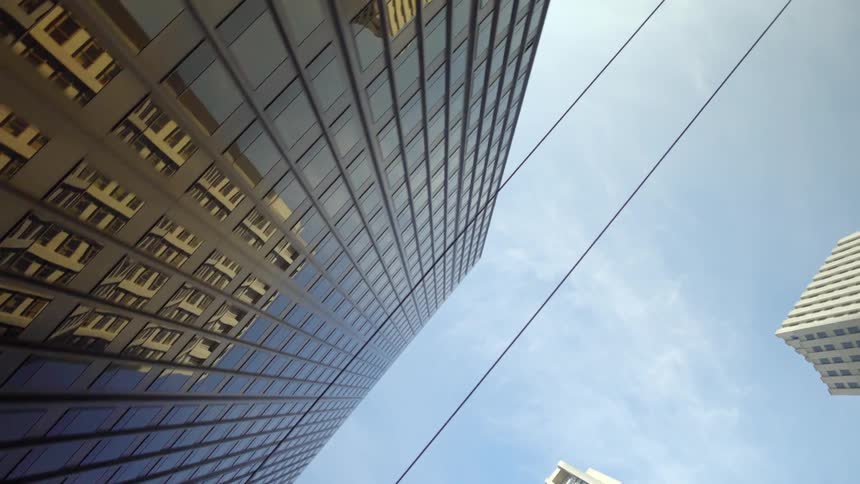 Tall city buildings tower overhead