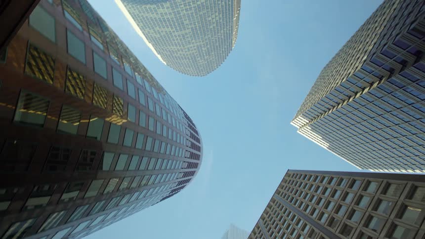 Tall city buildings tower overhead