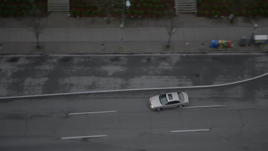 Cars driving down a street