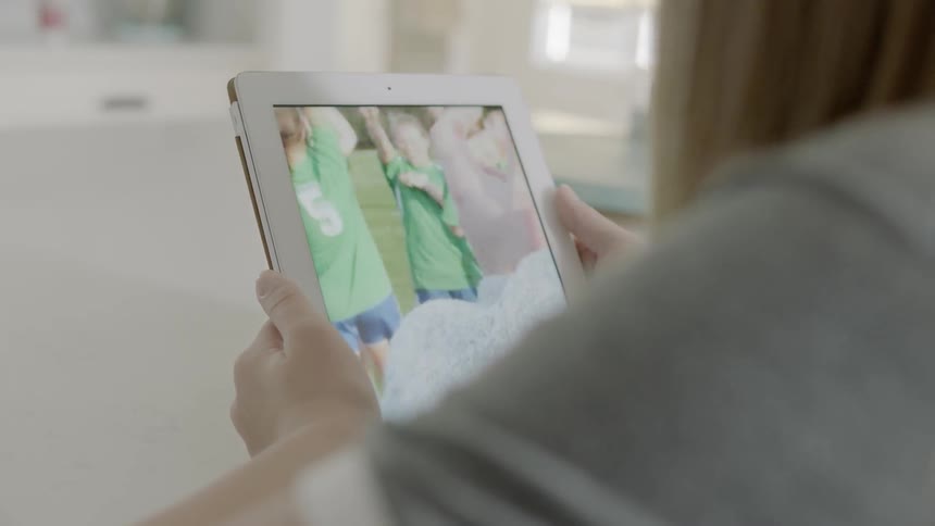 Someone is watching a soccer team celebrate on an ipad