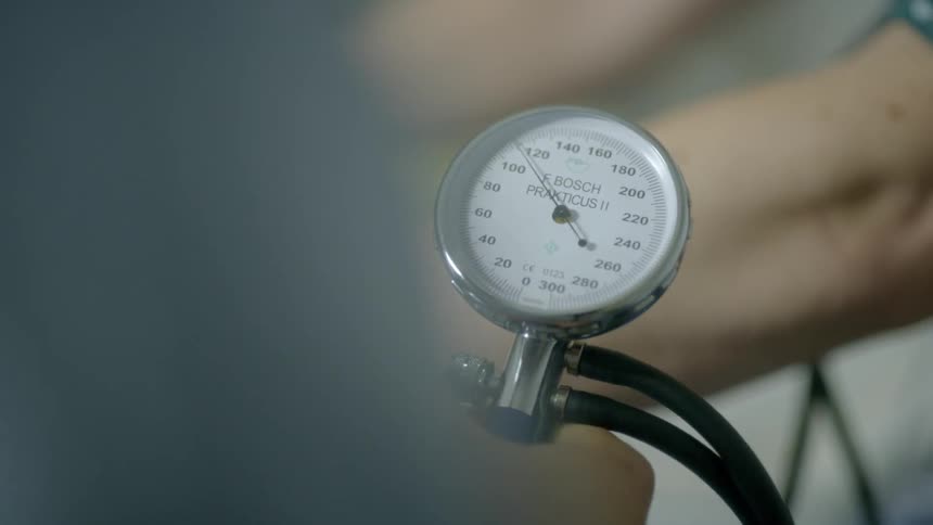 A person has their blood pressure taken