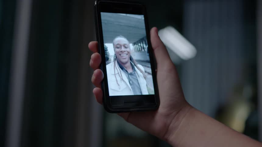 Someone is watching a video of a man on their phone